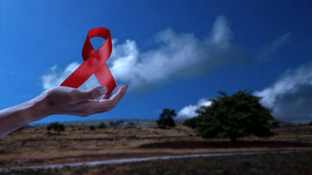 Human hand showing red ribbon awareness. World Aids Day conceptの写真素材