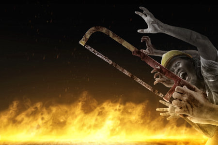 Zombie hands with a fire flames background. Scary Halloween conceptの写真素材
