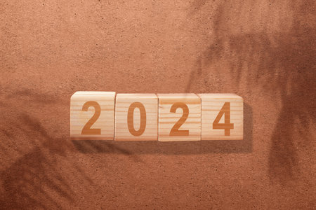 2024 on a red wall background. Happy New Year 2024の写真素材
