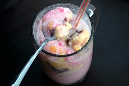Es doger. Traditional fruit ice from Indonesia with grated coconut, tapai, black sticky rice, and...