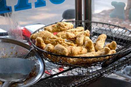 Batagor (Bakso Tahu Goreng) is served with peanut sauce and sauce. Traditional Indonesia foodの写真素材