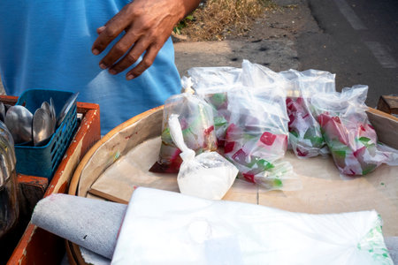 Es selendang mayang. Traditional dessert drink from Indonesia with rice flour pudding, coconut milk, and sugar sauce. Indonesian street foodの写真素材