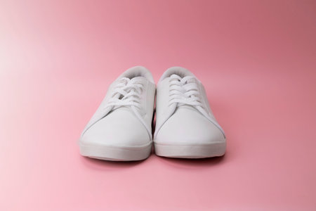 Closeup view of clean white sneakers on a colored backgroundの写真素材
