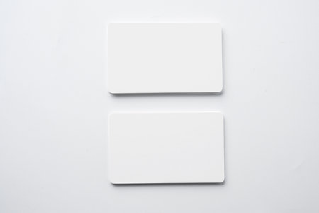 Stack of business cards on a white background. Empty business card for copy spaceの写真素材