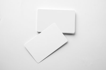 Stack of business cards on a white background. Empty business card for copy spaceの写真素材