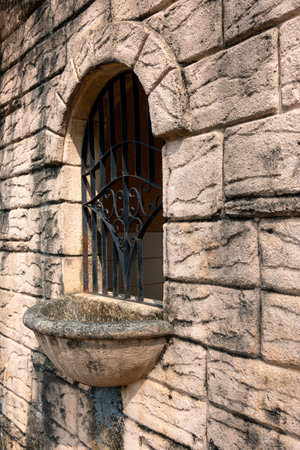 Window frame with iron fence and sunlight background