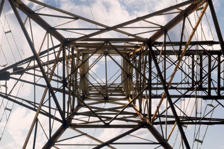 High voltage power lines tower with a sunset scene backgroundの写真素材