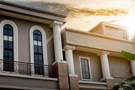 Residential houses in a housing area with a sunset scene backgroundの写真素材