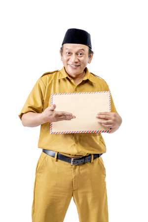 A civil servant man showing a brown envelope isolated over a white background. Pegawai Negeri Sipil (PNS)の写真素材