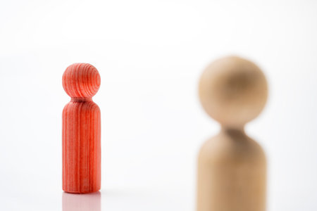 Closeup view of wooden figure isolated over white background