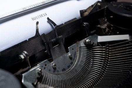Text of BUSINESS typed on a vintage typewriter. Business concept