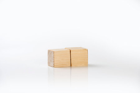 Closeup view of wooden cubes isolated over a white backgroundの写真素材
