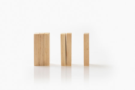A row of wooden blocks isolated over a white backgroundの写真素材