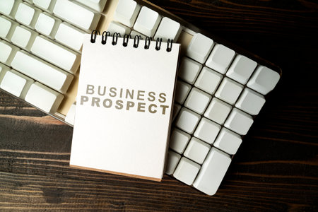 Closeup view of a notebook with Business Prospect text on a computer keyboard on a wooden background. Business management conceptの写真素材
