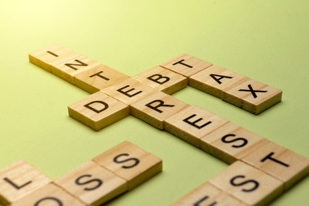 Close-up view of wooden cubes with financial words on a colored background. Financial conceptの写真素材