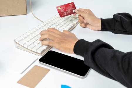 People hand holding credit cards with empty screens mobile phones for mobile payment, banking, or...