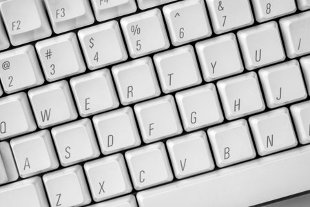Closeup view of a computer keyboard on a colored backgroundの写真素材