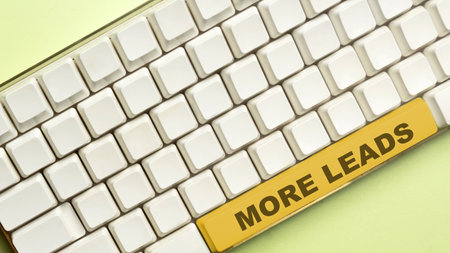 Keyboard button with more leads text over a colored background. New customer prospect concept