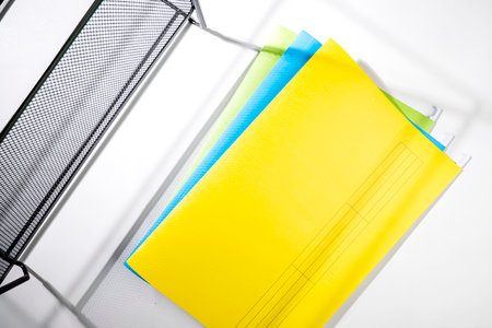 Stack of colorful document files isolated over a white background