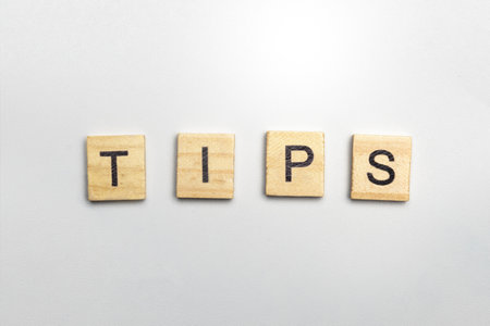 The row of wooden cubes with tips text on a white background. Tips and advice conceptの写真素材