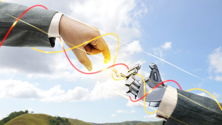 Robotic hand and business hand with digital world background. Artificial intelligence conceptの写真素材