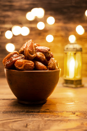 Image of tasty dried dates fruits with arabian light background. The Muslim feast of the holy month of Ramadan Kareem. Vegetarian and healthy snack.の写真素材