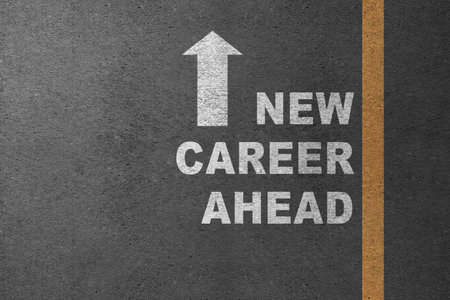 Arrow with the text of a new career ahead in the street. Business, job, and career conceptの写真素材