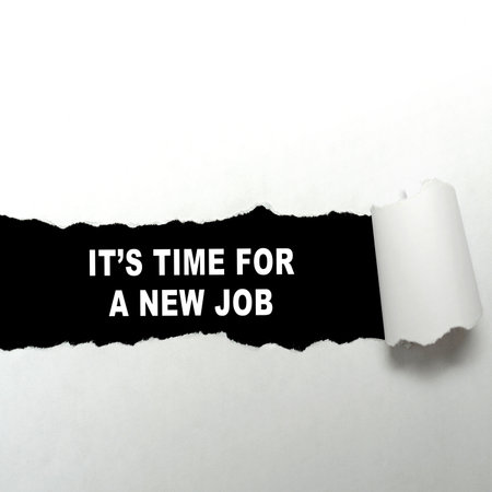Ripped paper with the text of its time for a new job on a black background. Business, job, and career conceptの写真素材