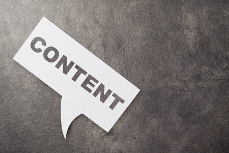 Paper with content text on a black background. Content manager, strategy and creativity conceptの写真素材