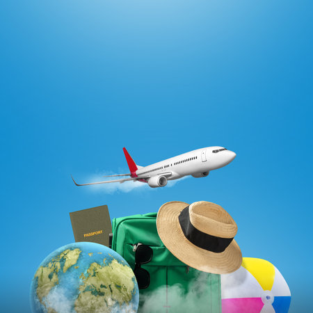 Flying airplane with globe, suitcase, passport, and beach hat on a colored background. Ready for traveling. Traveling conceptの写真素材