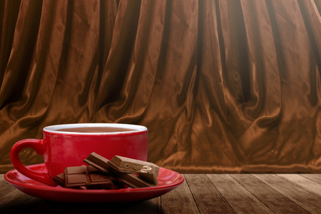 Chocolate pieces on chocolate drink in the cup on the table. World Chocolate Day conceptの写真素材