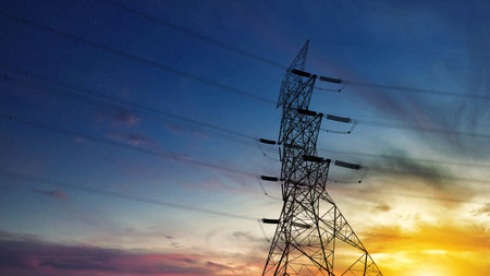 Close up bottom view electricity overhead power lines on sunset sky in Jakarta Indonesia. Industrial...