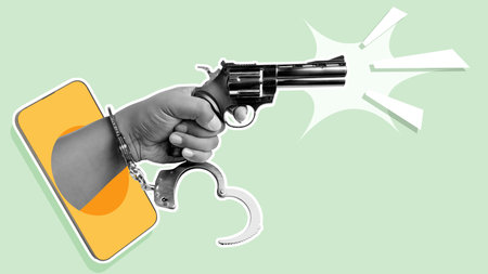 A human hand with handcuffs holding a gun through the mobile phone screen with a colored background....