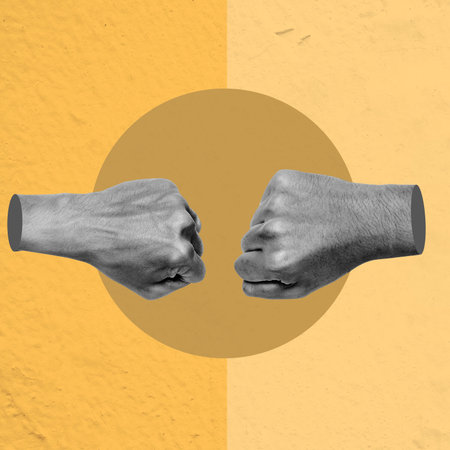 Two hands giving fist bumps together in a circle. Concept of unity and cooperationの写真素材