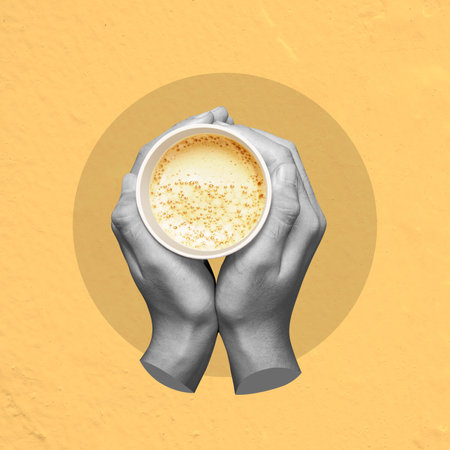 A hand holding a cup of coffee with steam rising from it. Concept of warmth and comfort, as the steam rising from the coffee cup suggests a hot beverage being enjoyed on a chilly dayの写真素材