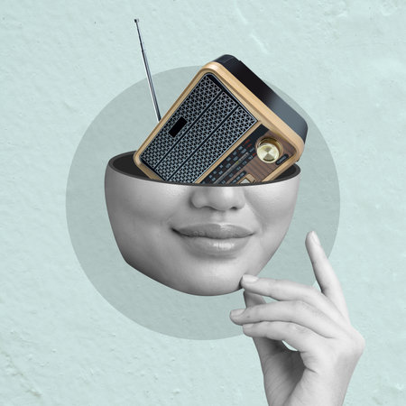 A woman's face is shown with a radio in her head. The radio is a small, old-fashioned model with a black and gold color scheme. The image is a creative and playful representation of the idea of musicの写真素材
