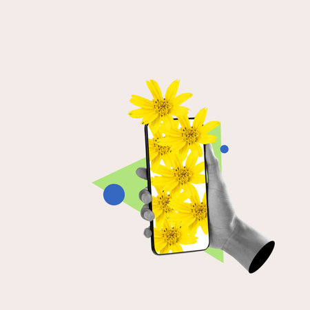 A human hand holding a mobile phone with a bunch of yellow flower petals on the screen with a colored background. Collage artの写真素材