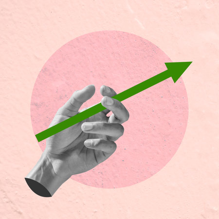 The human hand holds an increased arrow with a colored background. Collage artの写真素材
