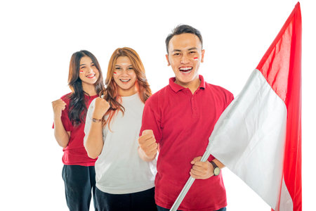 Portrait of Indonesian people with excited expressions carrying Indonesian flags isolated over a white backgroundの写真素材