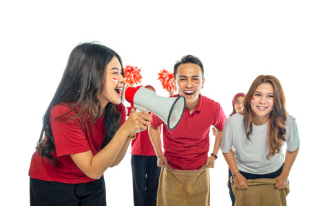 A group of people are playing a game of sack race. Scene is lighthearted and fun. Indonesian independence day conceptの写真素材