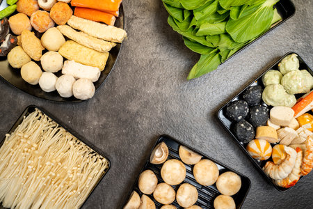A variety of food items including mushrooms, asparagus, and green vegetables are displayed in a...