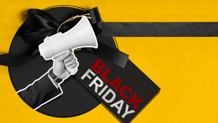 A man holding a megaphone with a black friday sign in the background. Concept of excitement and anticipation for the holiday seasonの写真素材