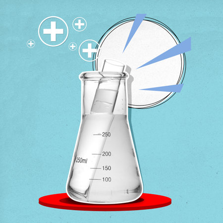 A white liquid in a beaker is poured into a glass tube on a colored background. Science conceptの写真素材