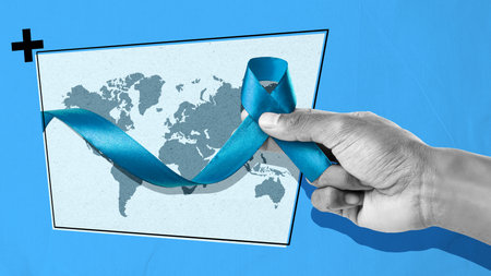 A hand holding a blue ribbon with a triangle in the background. World diabetes dayの写真素材