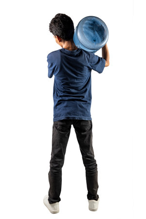 A man is holding a water gallon on his shoulder isolated on a white backgroundの写真素材