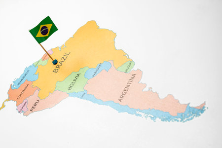 A map of Brazil with a Brazilian flag on it. The flag is green. Travel and government concept