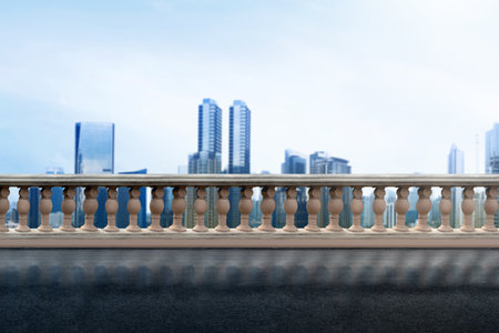 A city skyline with a clear blue sky and a few clouds. The city is bustling with activity and the...