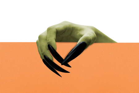 Witch hands with black nails holding a board on a white background. Empty board for copy space. The...