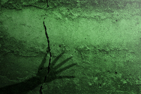 Shade of witch hands on dark background. The hand appearing to be devil, evil, satan, or monster hands. Spooky Halloween conceptの写真素材
