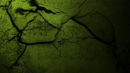 Surface of green concrete wall with cracks and holes. Abstract pattern of concrete wall. Mock up. Copy space. Wall textured backgroundの写真素材